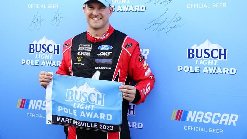 Apr 15, 2023; Martinsville, Virginia, USA; NASCAR Cup Series driver Ryan Preece (41) holds the pole award flag after capturing the pole during qualifying at Martinsville Speedway. Mandatory Credit: John David Mercer-USA TODAY Sports