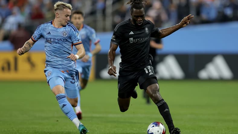 Apr 15, 2023; Queens, New York, USA; Nashville SC forward C.J. Sapong (17) controls the ball against New York City FC defender Mitja Ilenic (35) during the first half at Citi Field. Mandatory Credit: Brad Penner-USA TODAY Sports