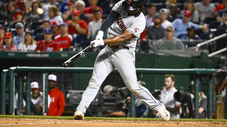 Apr 15, 2023; Washington, District of Columbia, USA; Cleveland Guardians first baseman Josh Bell (55) hits an RBI double against the Washington Nationals during the ninth inning at Nationals Park. Mandatory Credit: Brad Mills-USA TODAY Sports