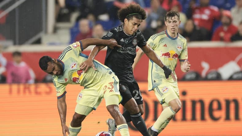 Apr 15, 2023; Harrison, New Jersey, USA; Houston Dynamo midfielder Adalberto Carrasquilla (20) plays the ball against New York Red Bulls midfielder Cristian Casseres Jr (23) during the first half at Red Bull Arena. Mandatory Credit: Vincent Carchietta-USA TODAY Sports
