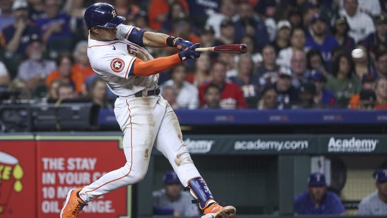 Apr 15, 2023; Houston, Texas, USA; Houston Astros shortstop Jeremy Pena hits an RBI double during the seventh inning against the Texas Rangers at Minute Maid Park. Mandatory Credit: Troy Taormina-USA TODAY Sports