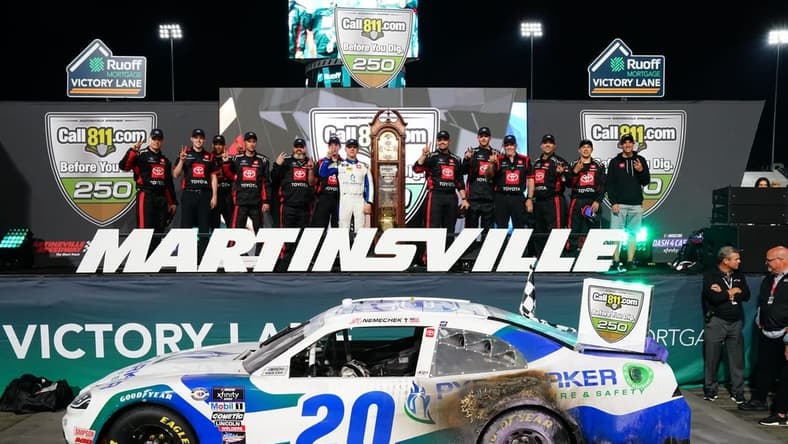 Apr 15, 2023; Martinsville, Virginia, USA; Xfinity Series driver John Hunter Nemechek (20) celebrates winning the Call 811.com Before You Dig 250 at Martinsville Speedway. Mandatory Credit: John David Mercer-USA TODAY Sports