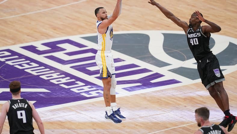 Apr 15, 2023; Sacramento, California, USA; Golden State Warriors guard Stephen Curry (30) makes a three point basket over Sacramento Kings forward Harrison Barnes (40) in the fourth quarter during game one of the 2023 NBA playoffs at the Golden 1 Center. Mandatory Credit: Cary Edmondson-USA TODAY Sports