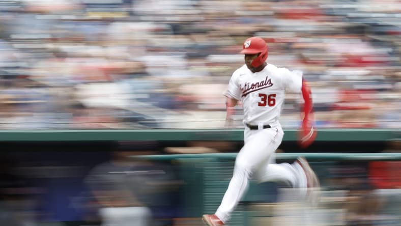 Apr 16, 2023; Washington, District of Columbia, USA; Washington Nationals left fielder Stone Garrett (36) scores a run on an RBI double by Nationals right fielder Lane Thomas (not pictured) against the Cleveland Guardians during the second inning at Nationals Park. Mandatory Credit: Geoff Burke-USA TODAY Sports