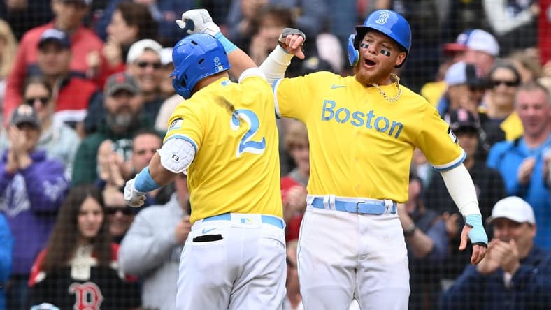 Apr 16, 2023; Boston, Massachusetts, USA; Boston Red Sox first baseman Justin Turner (2) celebrates with right fielder Alex Verdugo (99) after hitting a two run home run against the Los Angeles Angels during the third inning at Fenway Park. Mandatory Credit: Brian Fluharty-USA TODAY Sports