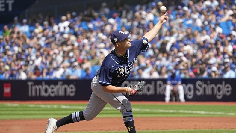 Apr 16, 2023; Toronto, Ontario, CAN; Tampa Bay Rays starting pitcher Shane McClanahan (18) pitches to the Toronto Blue Jays during the first inning at Rogers Centre. Mandatory Credit: John E. Sokolowski-USA TODAY Sports