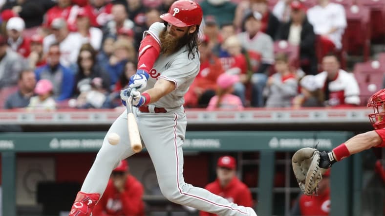 Apr 16, 2023; Cincinnati, Ohio, USA; Philadelphia Phillies center fielder Brandon Marsh hits a two-run single against the Cincinnati Reds during the first inning at Great American Ball Park. Mandatory Credit: David Kohl-USA TODAY Sports