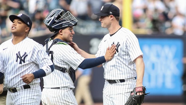 Apr 16, 2023; Bronx, New York, USA;  New York Yankees starting pitcher Gerrit Cole (45) celebrates with catcher Jose Trevino (39) after pitching a complete game shutout to beat the Minnesota Twins 2-0 at Yankee Stadium. Mandatory Credit: Wendell Cruz-USA TODAY Sports