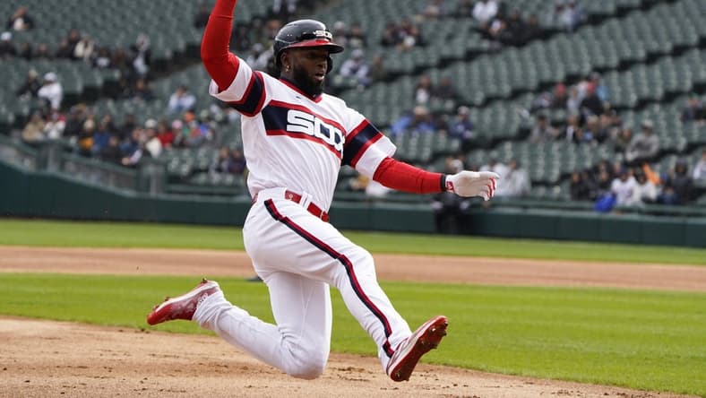 Apr 16, 2023; Chicago, Illinois, USA; Chicago White Sox center fielder Luis Robert Jr. (88) slides safely into third base against the Baltimore Orioles during the first inning at Guaranteed Rate Field. Mandatory Credit: David Banks-USA TODAY Sports