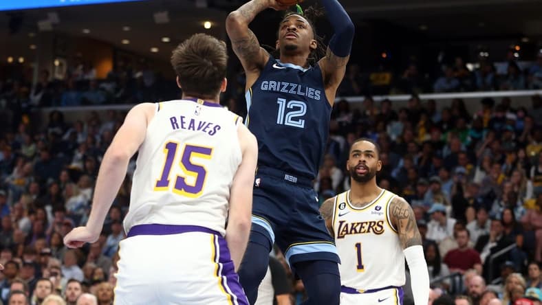 Apr 16, 2023; Memphis, Tennessee, USA; Memphis Grizzlies guard Ja Morant (12) shoots during the second half during game one of the 2023 NBA playoffs against the Los Angeles Lakers at FedExForum. Mandatory Credit: Petre Thomas-USA TODAY Sports