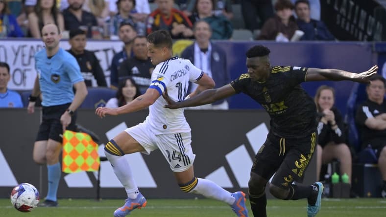 Apr 16, 2023; Carson, California, USA; Los Angeles Galaxy forward Javier Hernandez (14) control the ball defended by Los Angeles FC defender Jesus Murillo (3) in the second half at Dignity Health Sports Park. Mandatory Credit: Jayne Kamin-Oncea-USA TODAY Sports