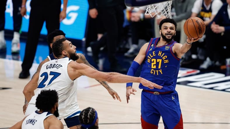 Apr 16, 2023; Denver, Colorado, USA; Denver Nuggets guard Jamal Murray (27)d rives to the net against Minnesota Timberwolves center Rudy Gobert (27) in the third quarter during game one of the 2023 NBA Playoffs at Ball Arena. Mandatory Credit: Isaiah J. Downing-USA TODAY Sports
