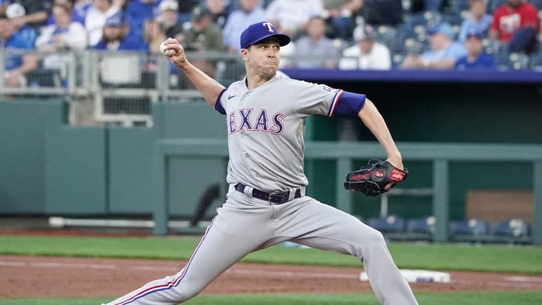 Apr 17, 2023; Kansas City, Missouri, USA; Texas Rangers starting pitcher Jacob deGrom (48) delivers a pitch against the Kansas City Royals during the first inning at Kauffman Stadium. Mandatory Credit: Denny Medley-USA TODAY Sports