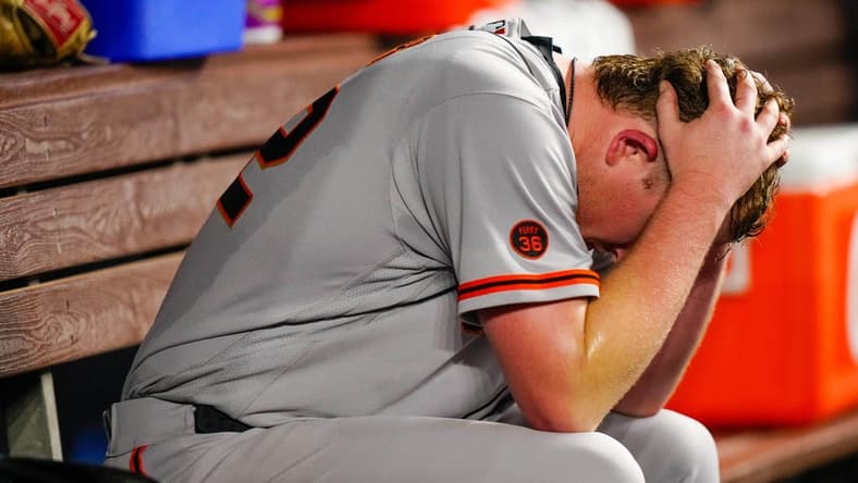 Apr 17, 2023; Miami, Florida, USA; San Francisco Giants starting pitcher Logan Webb (62) sits in the dug out after giving up a two-run home run against the Miami Marlins during the seventh inning at loanDepot Park. Mandatory Credit: Rich Storry-USA TODAY Sports