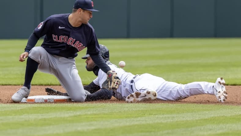 Apr 18, 2023; Detroit, Michigan, USA; Detroit Tigers center fielder Riley Greene (31) steals second base and beats the throw to Cleveland Guardians shortstop Tyler Freeman (2) at Comerica Park. Mandatory Credit: David Reginek-USA TODAY Sports