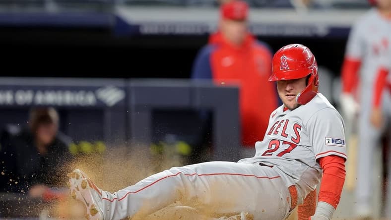Apr 18, 2023; Bronx, New York, USA; Los Angeles Angels center fielder Mike Trout (27) scores a run against the New York Yankees on a single by third baseman Anthony Rendon (not pictured) during the fourth inning at Yankee Stadium. Mandatory Credit: Brad Penner-USA TODAY Sports