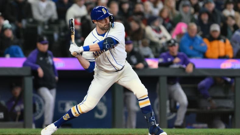 Apr 16, 2023; Seattle, Washington, USA; Seattle Mariners left fielder AJ Pollock (8) waits for the pitch against the Colorado Rockies at T-Mobile Park. Mandatory Credit: Steven Bisig-USA TODAY Sports