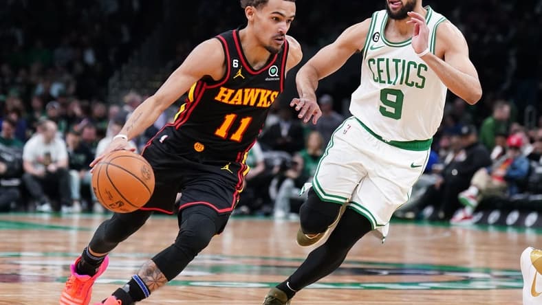 Apr 18, 2023; Boston, Massachusetts, USA; Atlanta Hawks guard Trae Young (11) drives the ball against Boston Celtics guard Derrick White (9) in the third quarter during game two of the 2023 NBA playoffs at TD Garden. Mandatory Credit: David Butler II-USA TODAY Sports