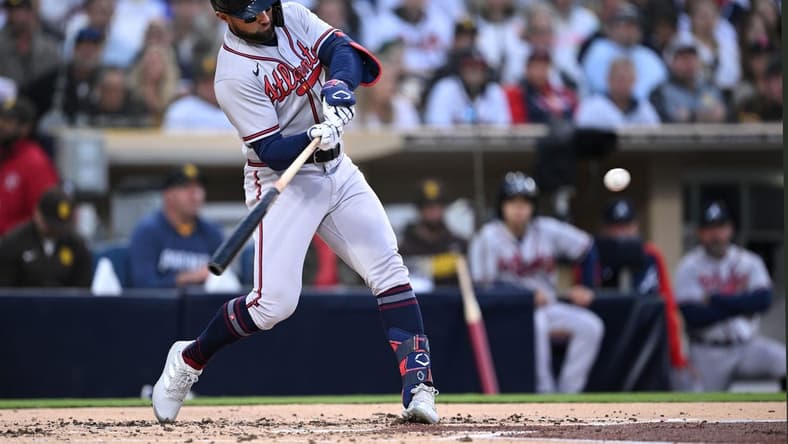 Apr 18, 2023; San Diego, California, USA; Atlanta Braves left fielder Kevin Pillar (17) hits an RBI double against the San Diego Padres during the second inning at Petco Park. Mandatory Credit: Orlando Ramirez-USA TODAY Sports