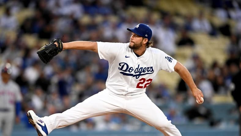 Apr 18, 2023; Los Angeles, California, USA; Los Angeles Dodgers starting pitcher Clayton Kershaw (22) throws in the first inning against the New York Mets at Dodger Stadium. Mandatory Credit: Jayne Kamin-Oncea-USA TODAY Sports
