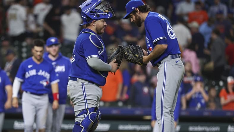 Apr 18, 2023; Houston, Texas, USA; Toronto Blue Jays catcher Alejandro Kirk (30) and relief pitcher Jordan Romano (68) celebrate after the Blue Jays defeated the Houston Astros at Minute Maid Park. Mandatory Credit: Troy Taormina-USA TODAY Sports