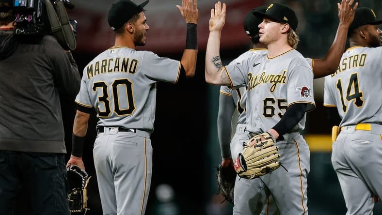 Apr 18, 2023; Denver, Colorado, USA; Pittsburgh Pirates center fielder Jack Suwinski (65) celebrates with second baseman Tucupita Marcano (30) after the game against the Colorado Rockies at Coors Field. Mandatory Credit: Isaiah J. Downing-USA TODAY Sports
