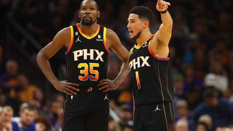 Apr 18, 2023; Phoenix, Arizona, USA; Phoenix Suns guard Devin Booker (1) with forward Kevin Durant (35) against the Los Angeles Clippers in the second half during game two of the 2023 NBA playoffs at Footprint Center. Mandatory Credit: Mark J. Rebilas-USA TODAY Sports