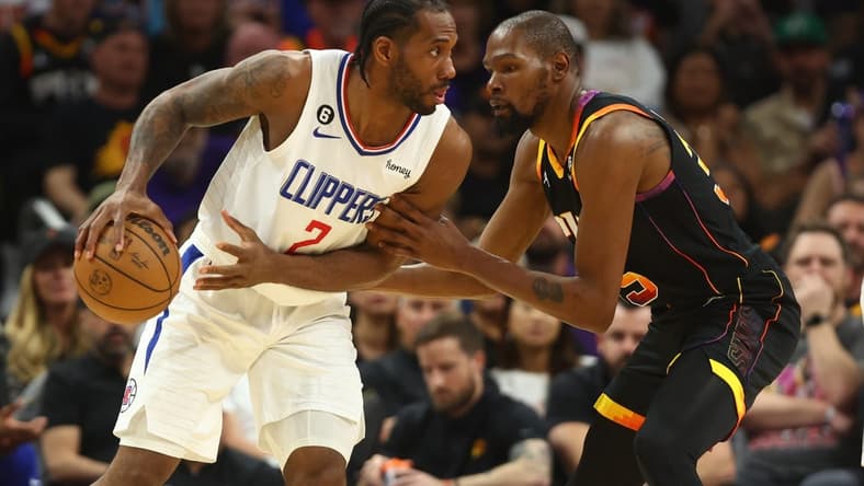 Apr 18, 2023; Phoenix, Arizona, USA; Los Angeles Clippers forward Kawhi Leonard (2) controls the ball against Phoenix Suns forward Kevin Durant (35) in the second half during game two of the 2023 NBA playoffs at Footprint Center. Mandatory Credit: Mark J. Rebilas-USA TODAY Sports