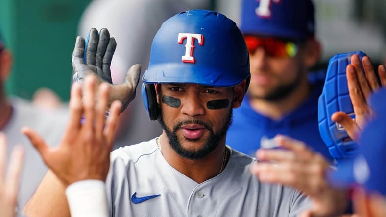 Apr 19, 2023; Kansas City, Missouri, USA; Texas Rangers center fielder Leody Taveras (3) celebrates with teammates in the dugout after scoring a run during the second inning against the Kansas City Royals at Kauffman Stadium. Mandatory Credit: Jay Biggerstaff-USA TODAY Sports