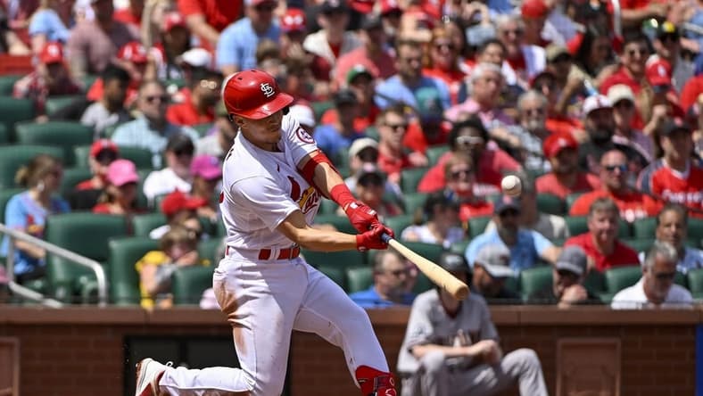 Apr 19, 2023; St. Louis, Missouri, USA;  St. Louis Cardinals shortstop Tommy Edman (19) hits a three run home run against the Arizona Diamondbacks during the third inning at Busch Stadium. Mandatory Credit: Jeff Curry-USA TODAY Sports