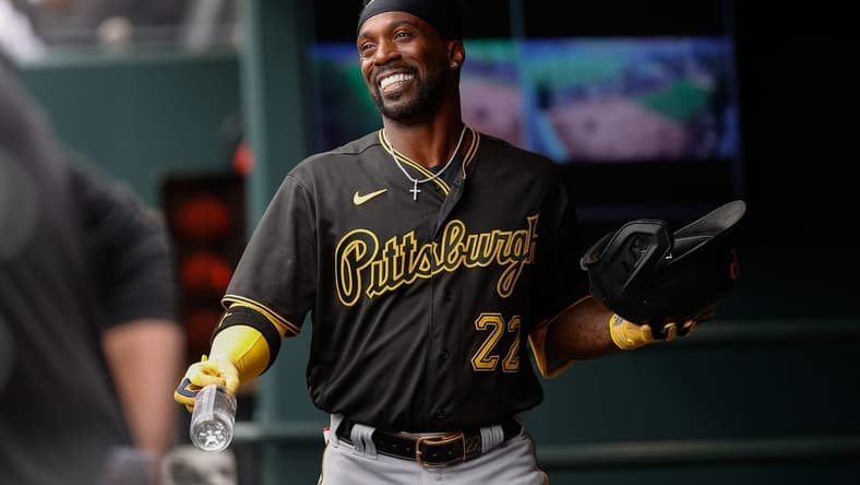 Apr 19, 2023; Denver, Colorado, USA; Pittsburgh Pirates designated hitter Andrew McCutchen (22) reacts in the dugout after hitting a solo home run in the second inning against the Colorado Rockies at Coors Field. Mandatory Credit: Isaiah J. Downing-USA TODAY Sports