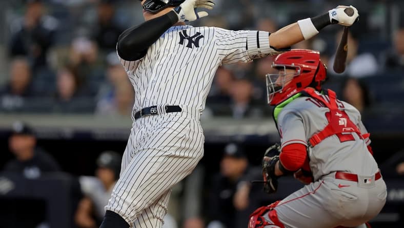 Apr 19, 2023; Bronx, New York, USA; New York Yankees center fielder Aaron Judge (99) follows through on a two run home run against the Los Angeles Angels during the first inning at Yankee Stadium. Mandatory Credit: Brad Penner-USA TODAY Sports