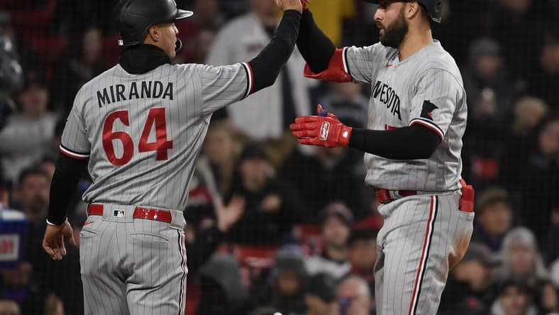 Apr 19, 2023; Boston, Massachusetts, USA;  Minnesota Twins first baseman Joey Gallo (13) high fives third baseman Jose Miranda (64) after hitting a two-run home run during the third inning against the Boston Red Sox at Fenway Park. Mandatory Credit: Bob DeChiara-USA TODAY Sports