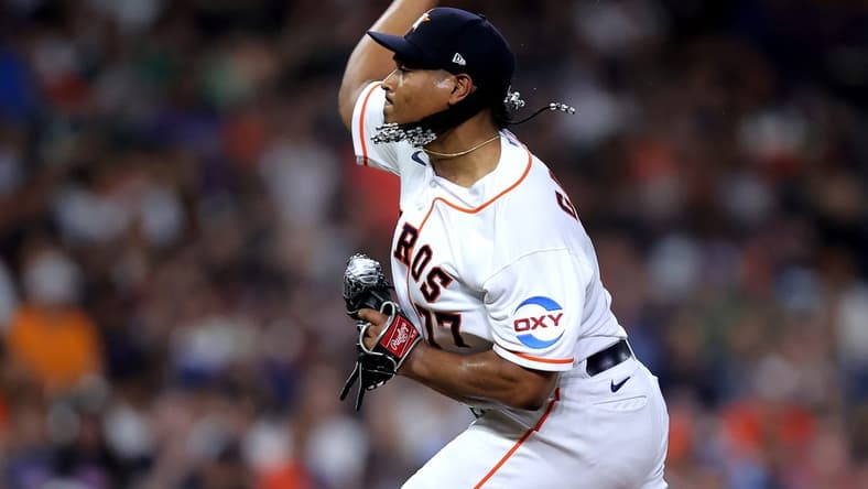 Apr 19, 2023; Houston, Texas, USA; Houston Astros starting pitcher Luis Garcia (77) delivers a pitch against the Toronto Blue Jays during the fourth inning at Minute Maid Park. Mandatory Credit: Erik Williams-USA TODAY Sports