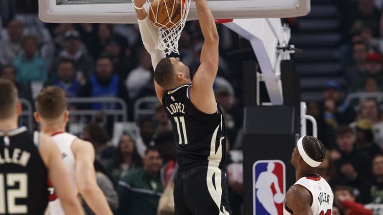 Apr 19, 2023; Milwaukee, Wisconsin, USA; Milwaukee Bucks center Brook Lopez (11) dunks during the first quarter against the Miami Heat during game two of the 2023 NBA Playoffs at Fiserv Forum. Mandatory Credit: Jeff Hanisch-USA TODAY Sports