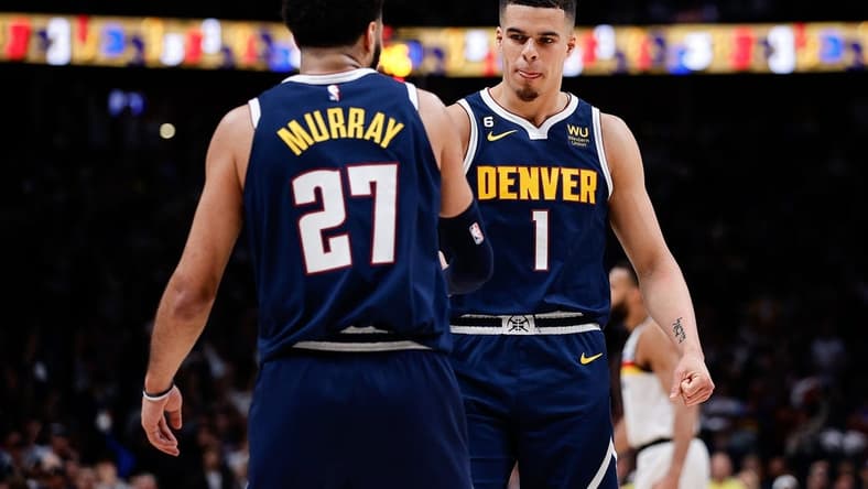 Apr 19, 2023; Denver, Colorado, USA; Denver Nuggets forward Michael Porter Jr. (1) reacts with guard Jamal Murray (27) in the fourth quarter during game two of the 2023 NBA Playoffs at Ball Arena. Mandatory Credit: Isaiah J. Downing-USA TODAY Sports