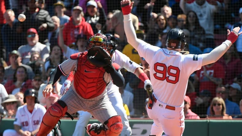 Apr 20, 2023; Boston, Massachusetts, USA; Boston Red Sox right fielder Alex Verdugo (99) slides home against the Minnesota Twins during the third inning at Fenway Park. Mandatory Credit: Eric Canha-USA TODAY Sports