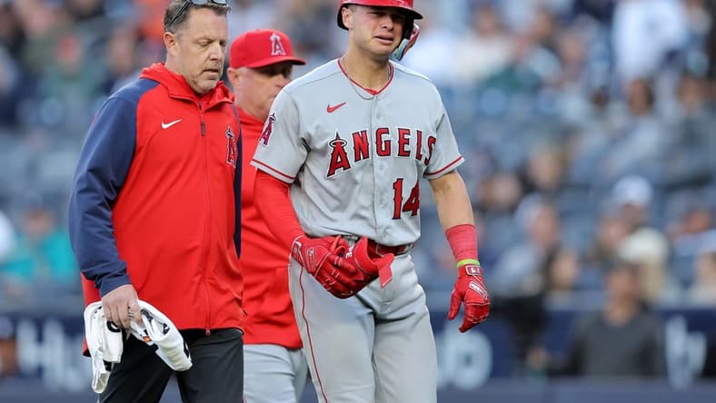 Apr 20, 2023; Bronx, New York, USA; Los Angeles Angels catcher Logan O'Hoppe (14) reacts as he leaves the game after injuring himself on a swing during the ninth inning against the New York Yankees at Yankee Stadium. Mandatory Credit: Brad Penner-USA TODAY Sports