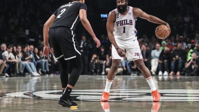 Apr 20, 2023; Brooklyn, New York, USA; Philadelphia 76ers guard James Harden (1) looks to drive past Brooklyn Nets forward Cameron Johnson (2) during game three of the 2023 NBA playoffs at Barclays Center. Mandatory Credit: Wendell Cruz-USA TODAY Sports