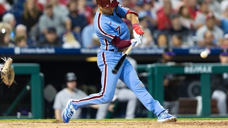Apr 20, 2023; Philadelphia, Pennsylvania, USA; Philadelphia Phillies shortstop Trea Turner (7) hits a double during the eighth inning against the Colorado Rockies at Citizens Bank Park. Mandatory Credit: Bill Streicher-USA TODAY Sports