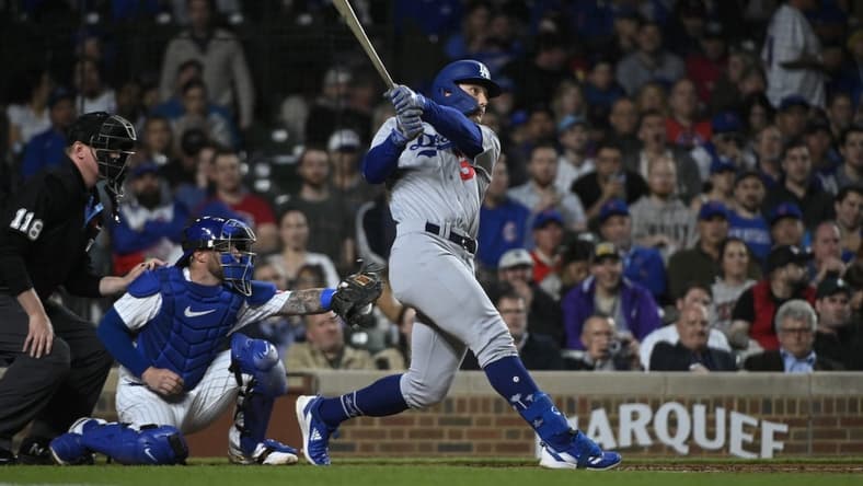 Apr 20, 2023; Chicago, Illinois, USA; Los Angeles Dodgers center fielder James Outman (33) hits a home run against the Chicago Cubs during the third inning at Wrigley Field. Mandatory Credit: Matt Marton-USA TODAY Sports
