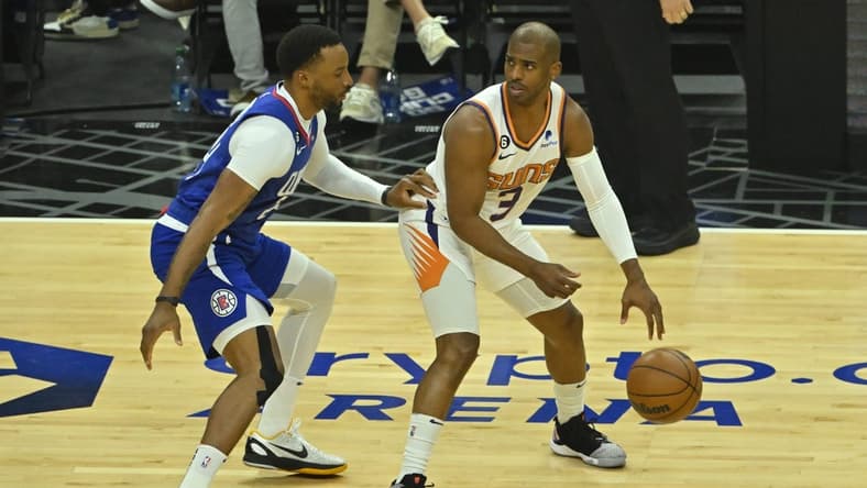 Apr 20, 2023; Los Angeles, California, USA; Los Angeles Clippers guard Norman Powell (24) guards Phoenix Suns guard Chris Paul (3) in the first quarter at Crypto.com Arena. Mandatory Credit: Jayne Kamin-Oncea-USA TODAY Sports