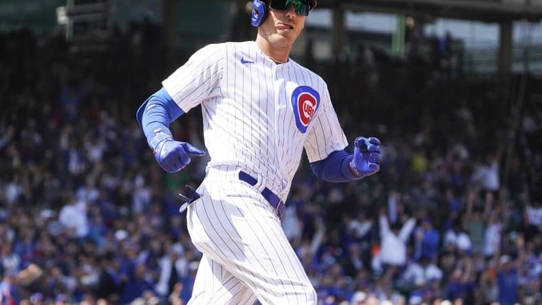 Apr 21, 2023; Chicago, Illinois, USA; Chicago Cubs center fielder Cody Bellinger (24) looks at the Los Angeles Dodgers dugout after hitting a home run during the third inning at Wrigley Field. Mandatory Credit: David Banks-USA TODAY Sports