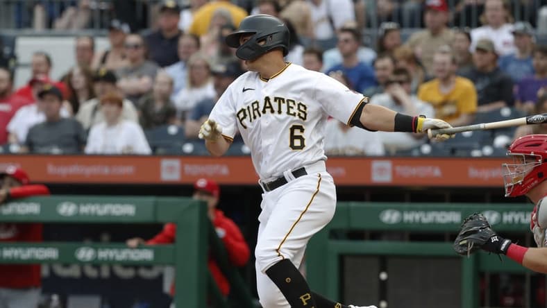 Apr 21, 2023; Pittsburgh, Pennsylvania, USA; Pittsburgh Pirates second baseman Mark Mathias (6) hits a two run single against the Cincinnati Reds during the second inning at PNC Park. Mandatory Credit: Charles LeClaire-USA TODAY Sports