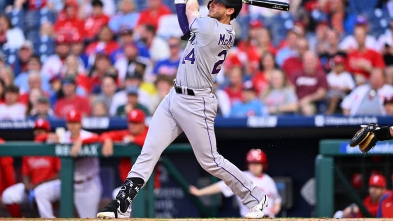 Apr 21, 2023; Philadelphia, Pennsylvania, USA; Colorado Rockies third baseman Ryan McMahon (24) hits a three-run home run against the Philadelphia Phillies in the first inning at Citizens Bank Park. Mandatory Credit: Kyle Ross-USA TODAY Sports