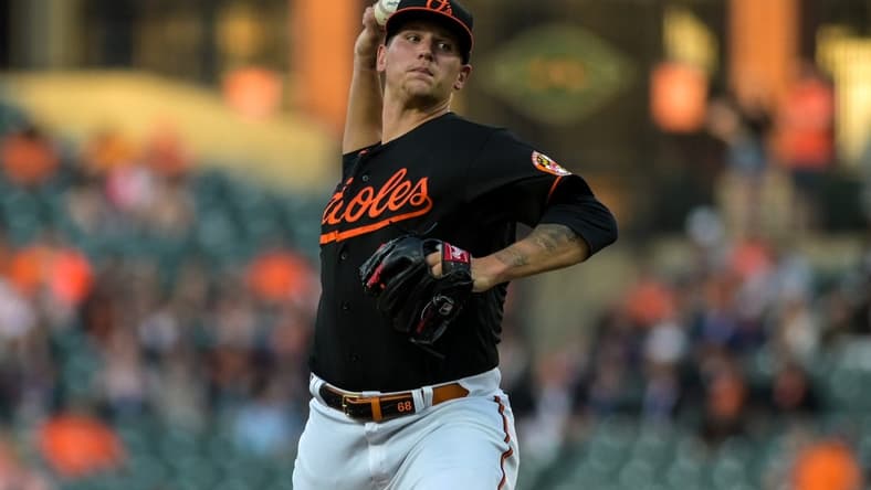 Apr 21, 2023; Baltimore, Maryland, USA;  Baltimore Orioles starting pitcher Tyler Wells (68) throws a first inning pitch against the Detroit Tigers at Oriole Park at Camden Yards. Mandatory Credit: Tommy Gilligan-USA TODAY Sports