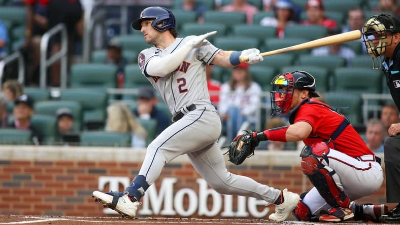 Apr 21, 2023; Atlanta, Georgia, USA; Houston Astros third baseman Alex Bregman (2) hits an RBI double against the Atlanta Braves in the first inning at Truist Park. Mandatory Credit: Brett Davis-USA TODAY Sports