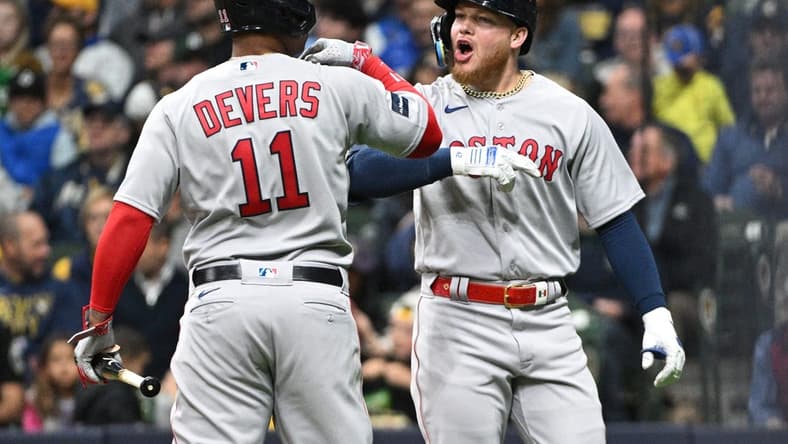 Apr 21, 2023; Milwaukee, Wisconsin, USA; Boston Red Sox right fielder Alex Verdugo (99) celebrates with Boston Red Sox third baseman Rafael Devers (11) after hitting a home run against the Milwaukee Brewers in the third inningat American Family Field. Mandatory Credit: Michael McLoone-USA TODAY Sports