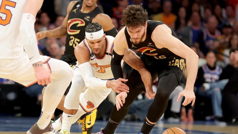 Apr 21, 2023; New York, New York, USA; New York Knicks guard Trevor Keels (3) and Cleveland Cavaliers forward Cedi Osman (16) fight for a loose ball during the second quarter of game three of the 2023 NBA playoffs at Madison Square Garden. Mandatory Credit: Brad Penner-USA TODAY Sports