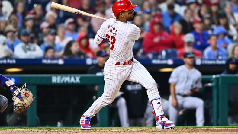 Apr 21, 2023; Philadelphia, Pennsylvania, USA; Philadelphia Phillies third baseman Edmundo Sosa (33) hits an RBI single against the Colorado Rockies in the eighth inning at Citizens Bank Park. Mandatory Credit: Kyle Ross-USA TODAY Sports